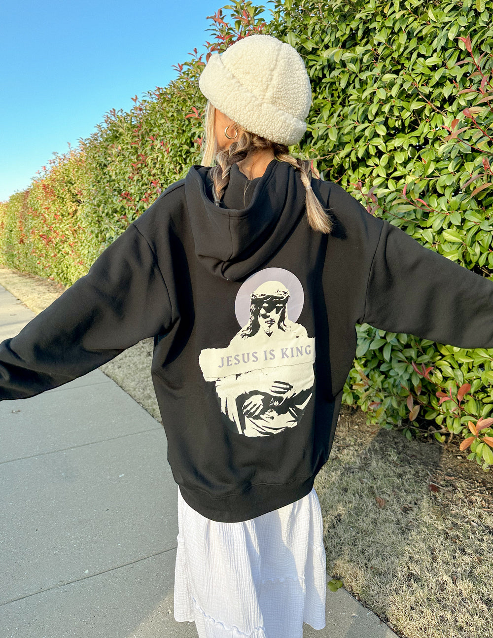 Black unisex hoodie with large back portrait graphic and text