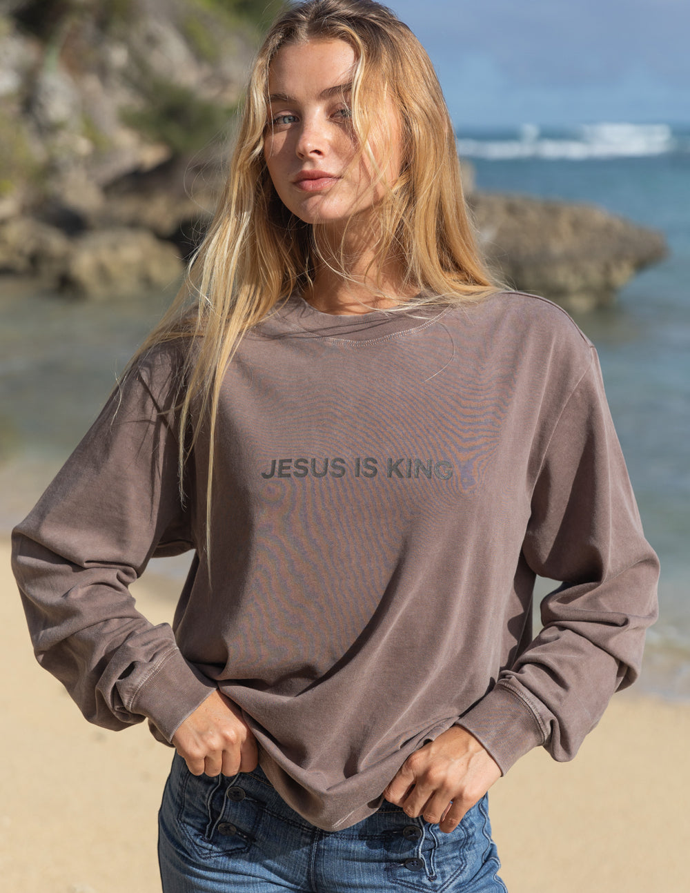 Brown long-sleeve unisex T-shirt with “JESUS IS KING” chest print, crew neck