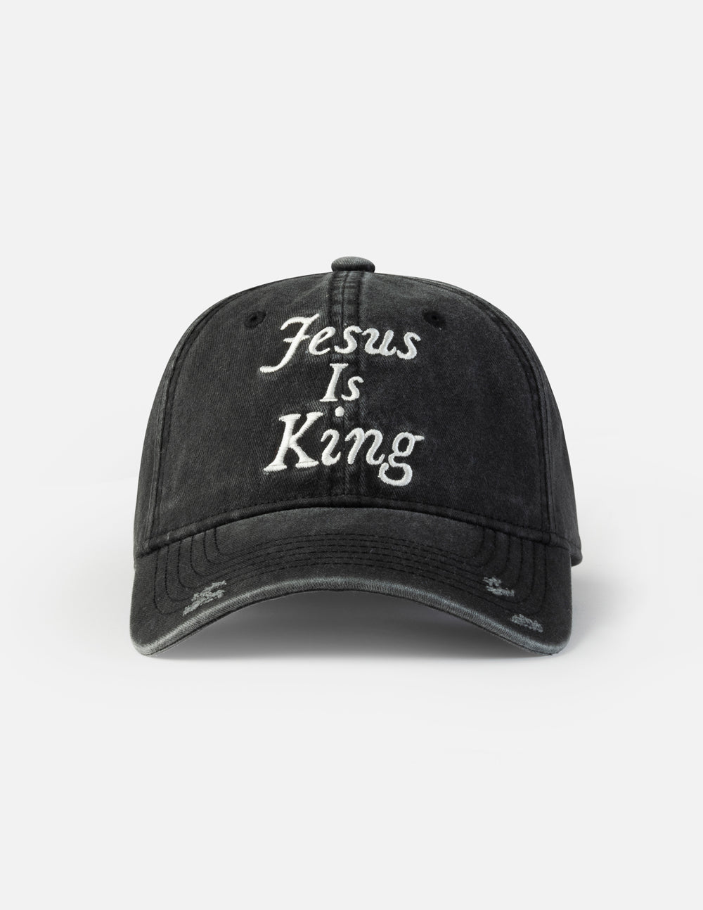 Black baseball cap with embroidered “Jesus Is King” on the front panel