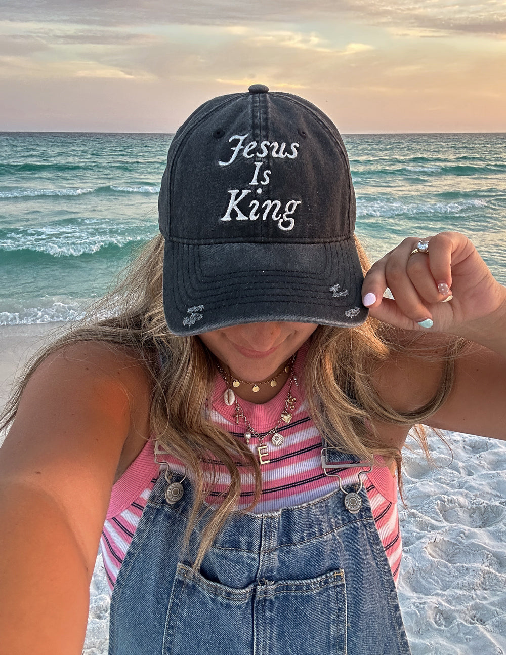 Black cap with embroidered “Jesus Is King” centered on the front