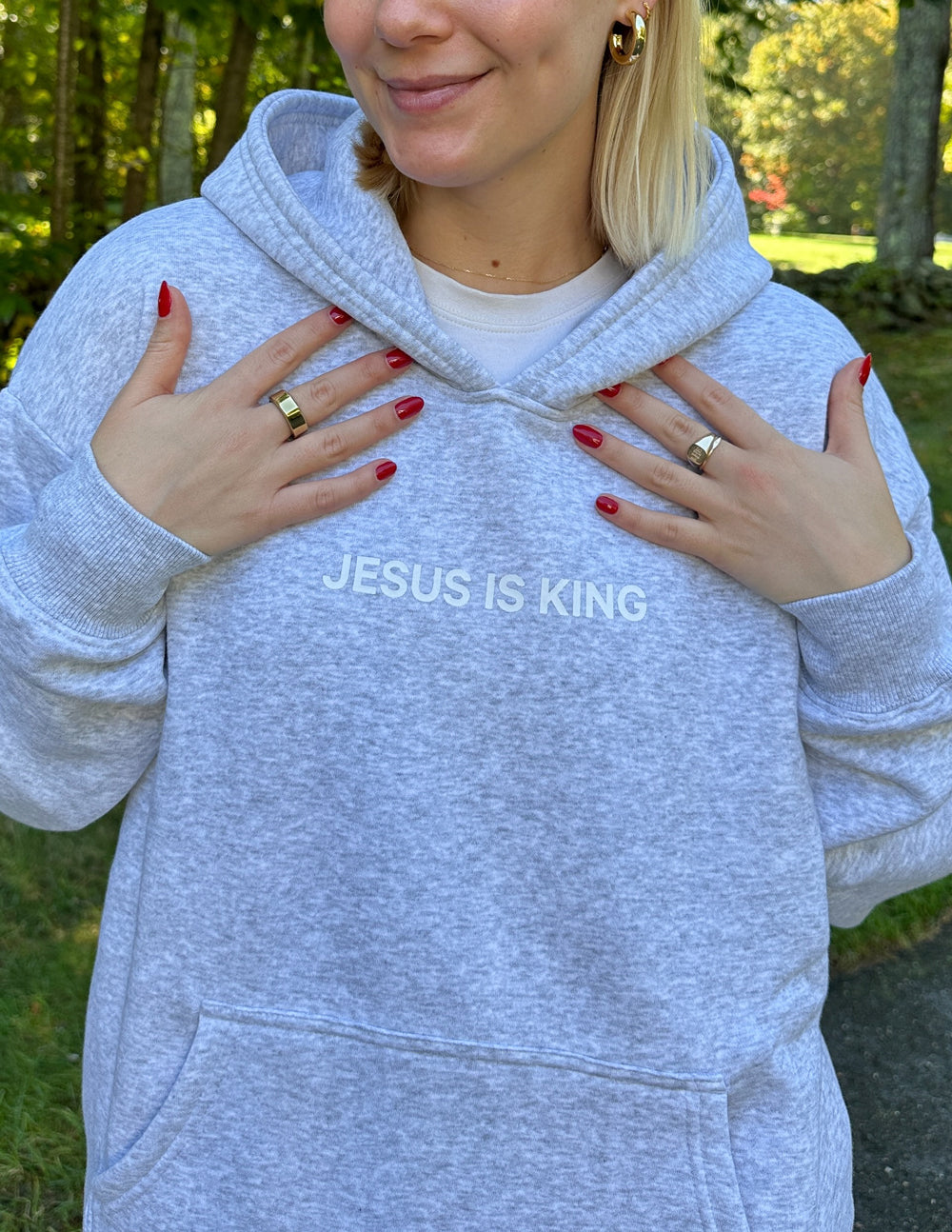 Heather grey unisex hoodie with hood and Jesus Is King chest print, kangaroo pocket