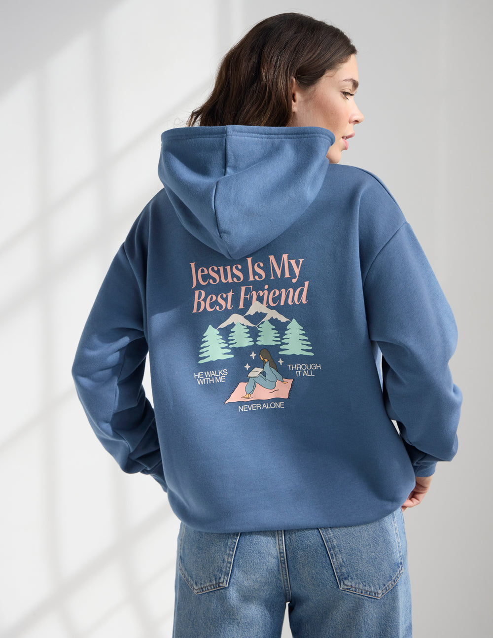 Blue unisex hoodie with "Jesus Is My Best Friend" graphic on back, pine trees below