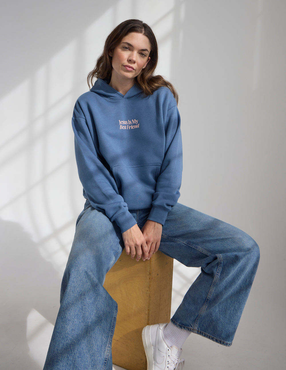 Blue unisex hoodie with "Jesus Is My Best Friend" logo on front pocket area