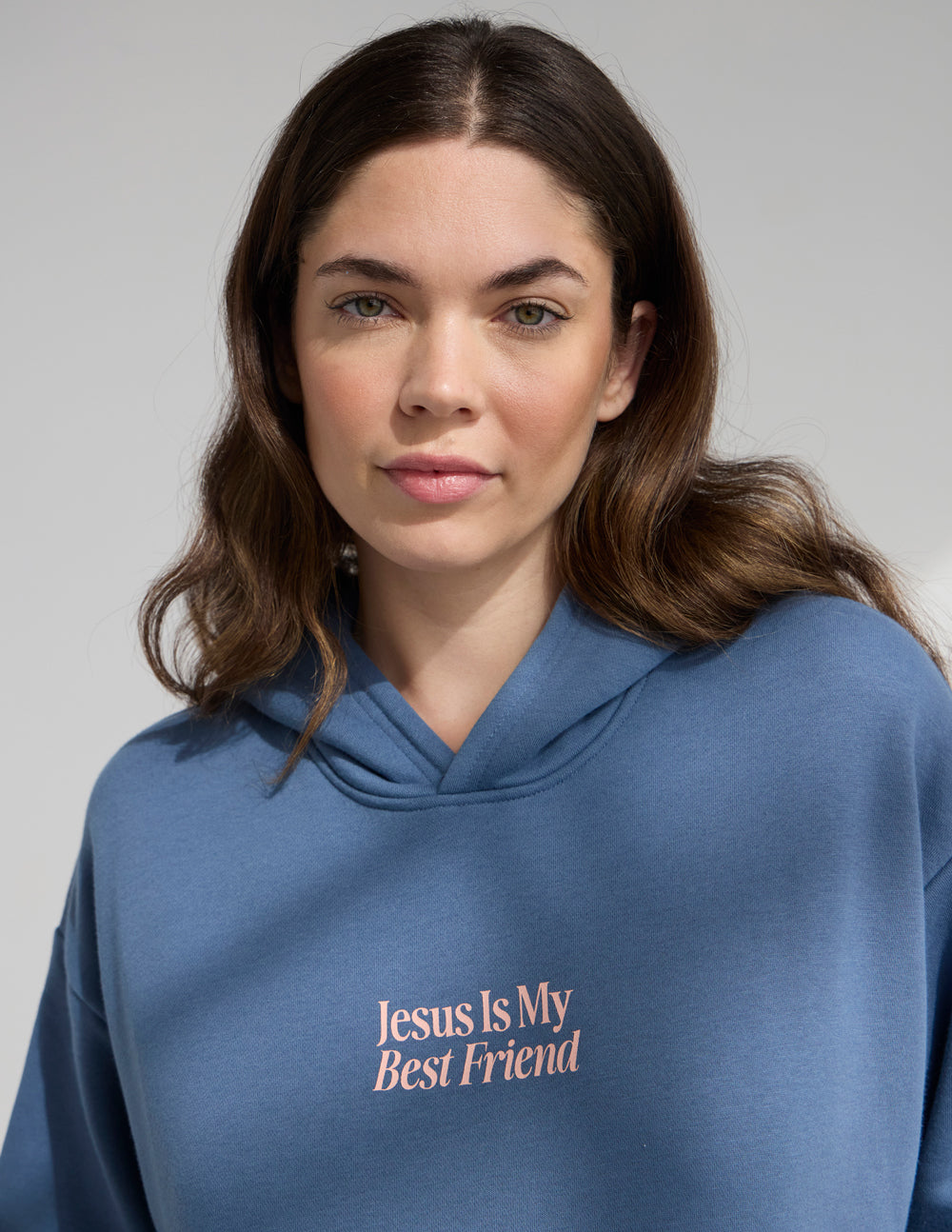 Blue unisex hoodie with "Jesus Is My Best Friend" front logo, close-up