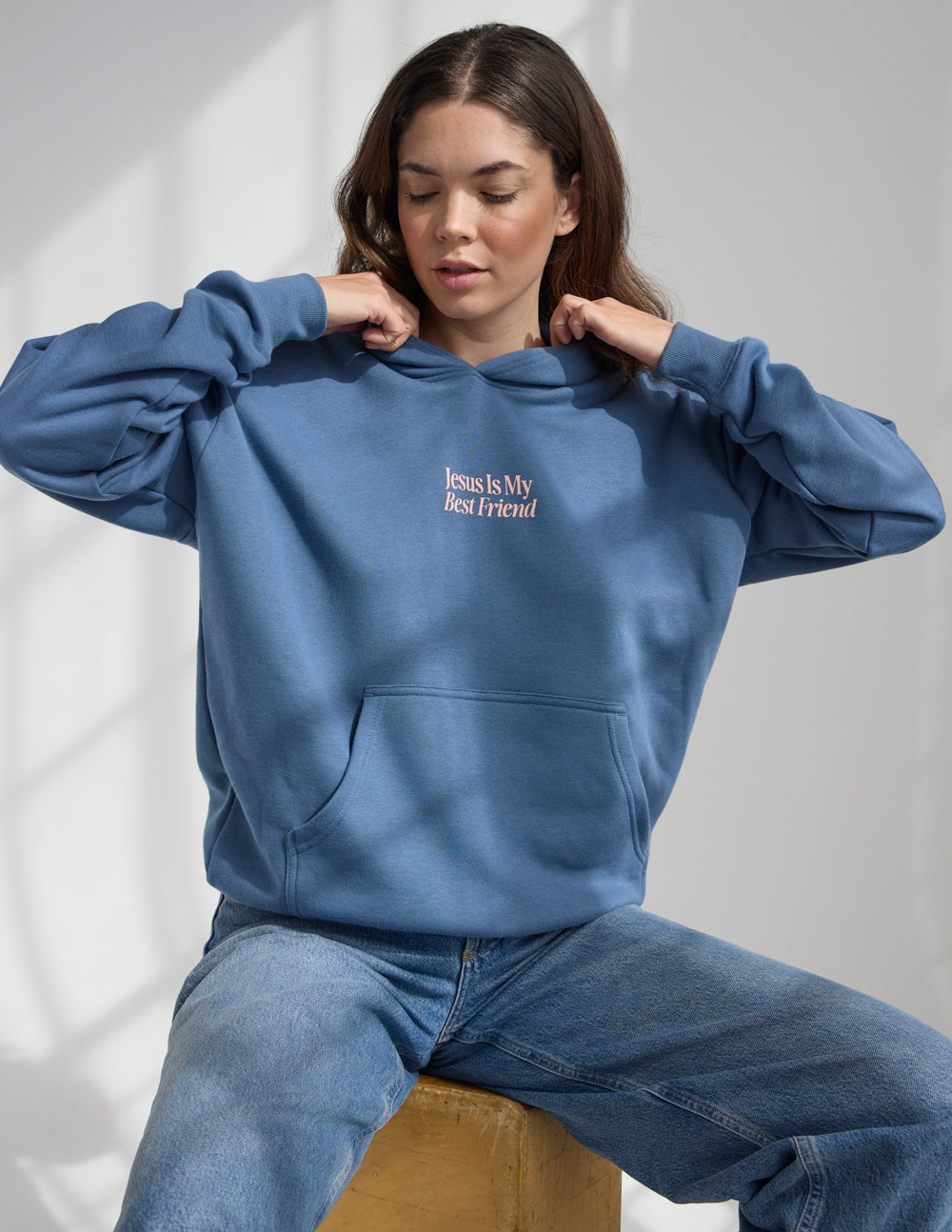 Blue unisex hoodie with front "Jesus Is My Best Friend" logo and drawstring hood