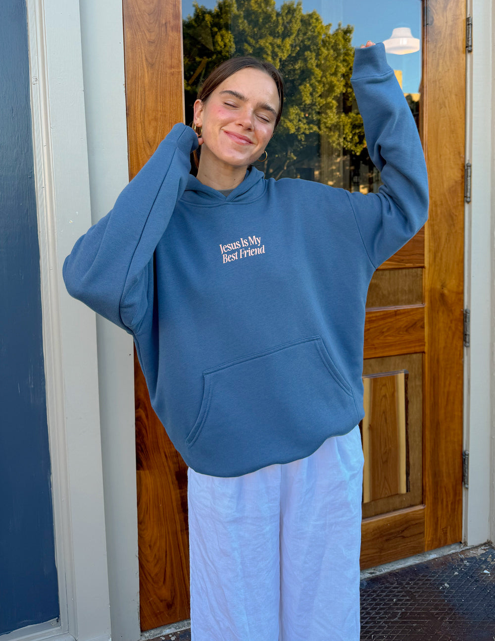 Blue unisex hoodie with "Jesus Is My Best Friend" front logo, hands raised