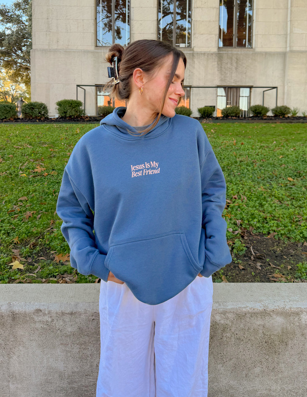 Blue unisex hoodie with "Jesus Is My Best Friend" front graphic, side view