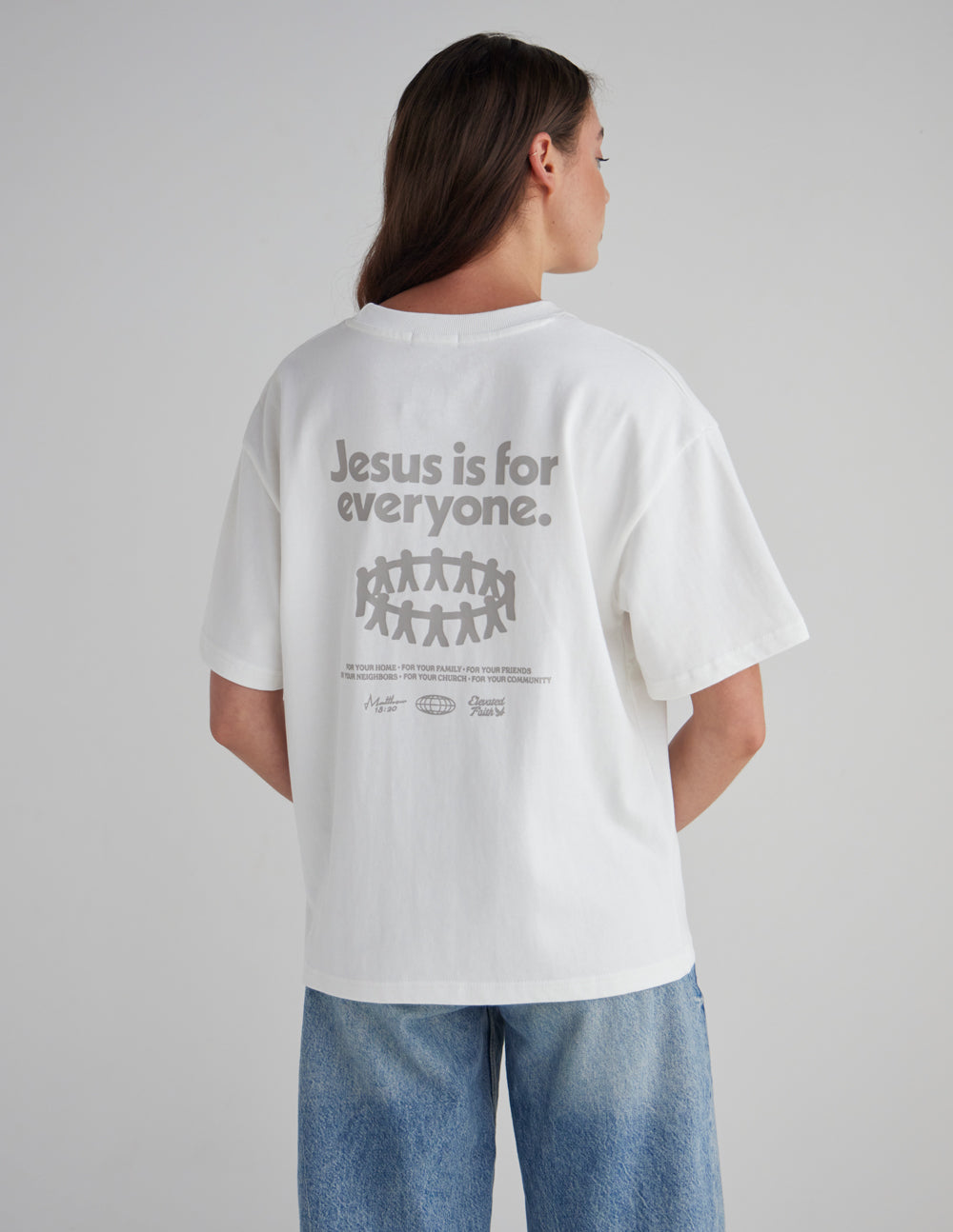 White heavyweight graphic T-shirt on model, back print with centered logo text and symbols