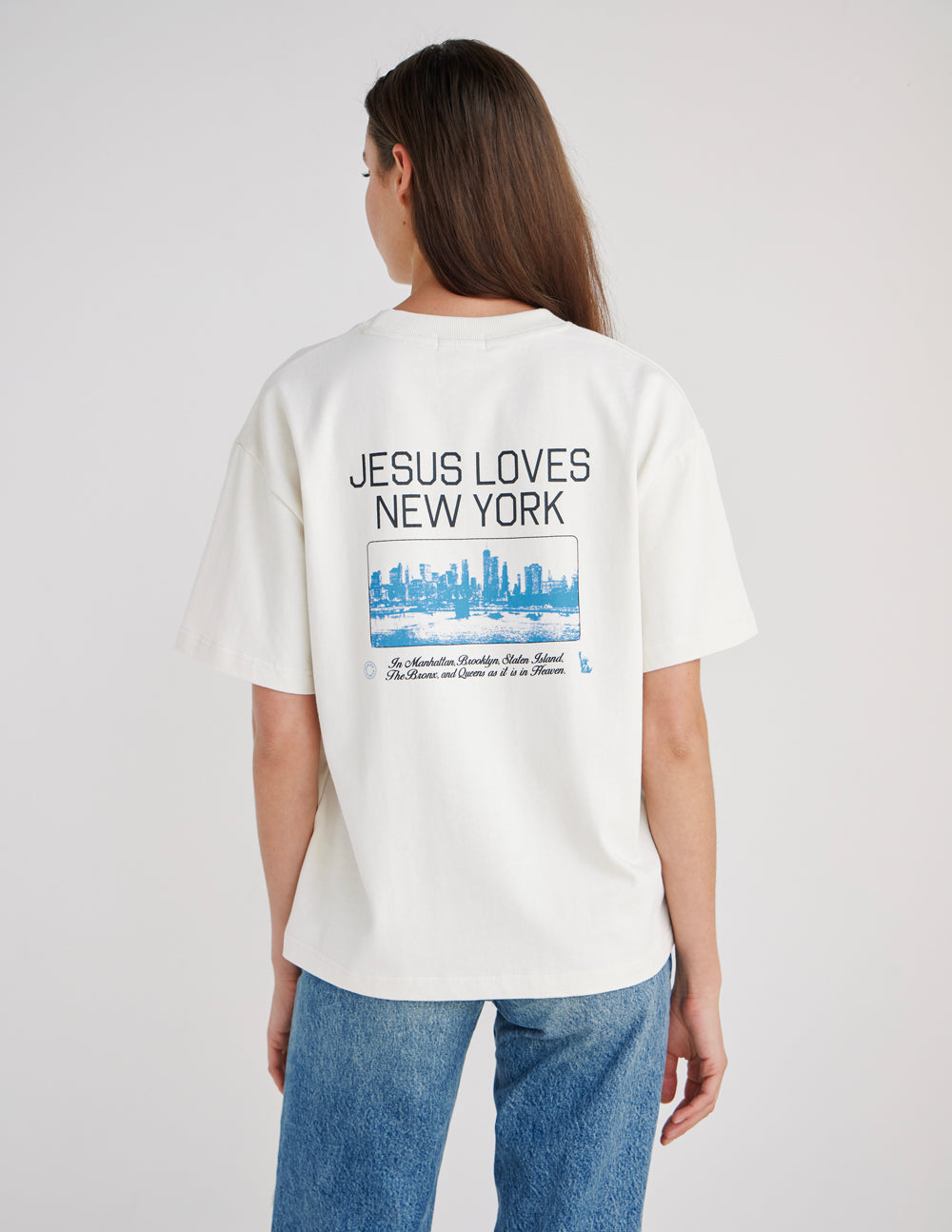 White heavyweight T-shirt with large back “JESUS LOVES NEW YORK” skyline graphic