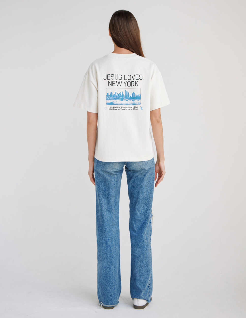 White heavyweight T-shirt, back “JESUS LOVES NEW YORK” skyline graphic visible