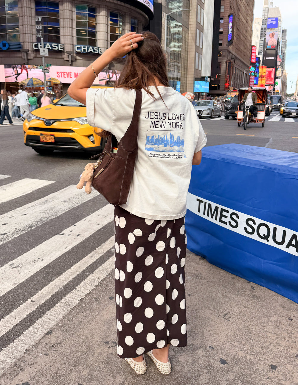 White heavyweight T-shirt with large back “JESUS LOVES NEW YORK” skyline graphic