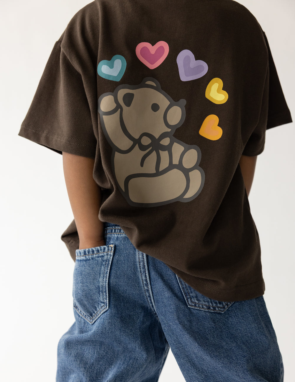 Kids brown T-shirt close-up of dog graphic with colorful hearts; short sleeves