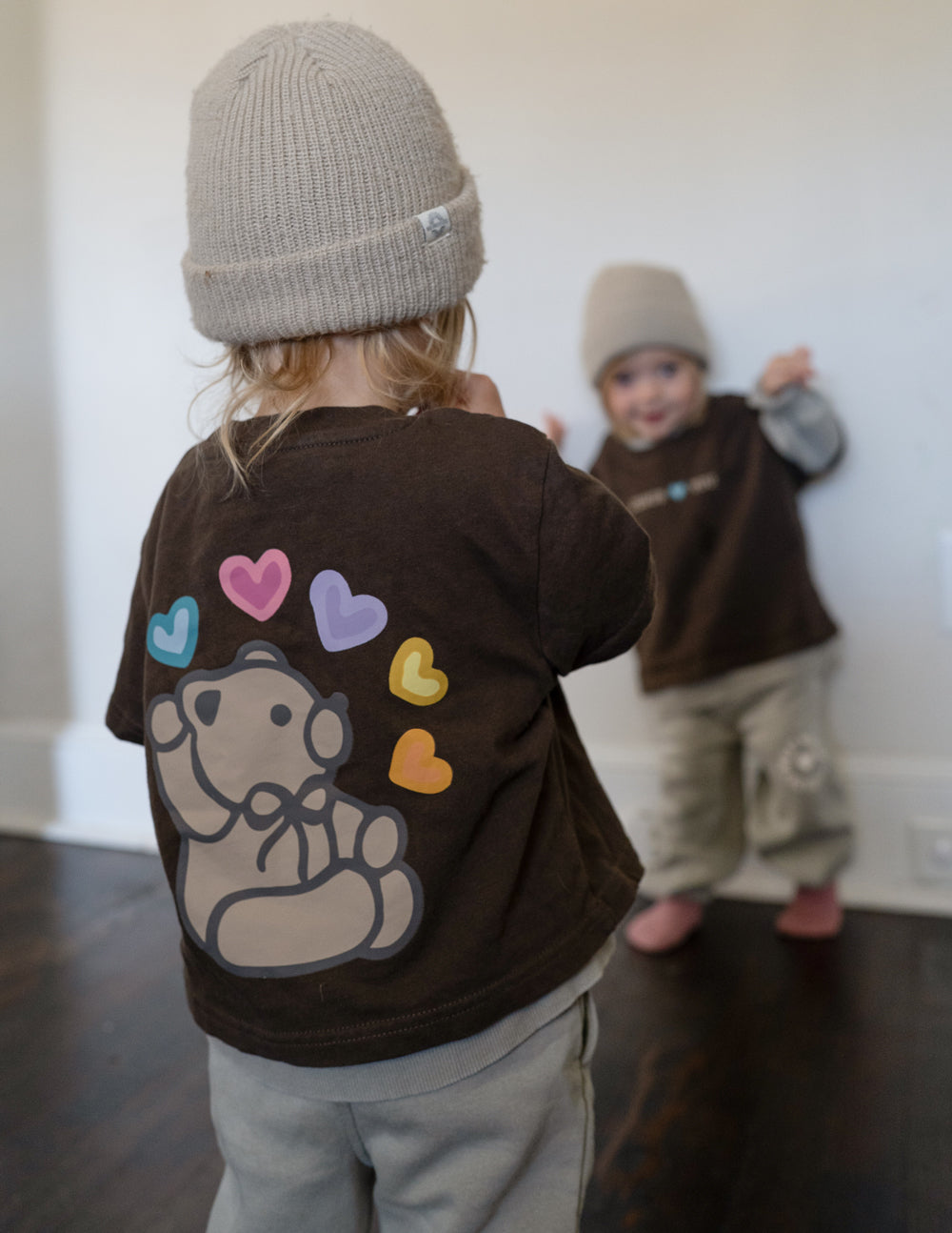 Kids brown T-shirt back print of bear with colorful heart accents