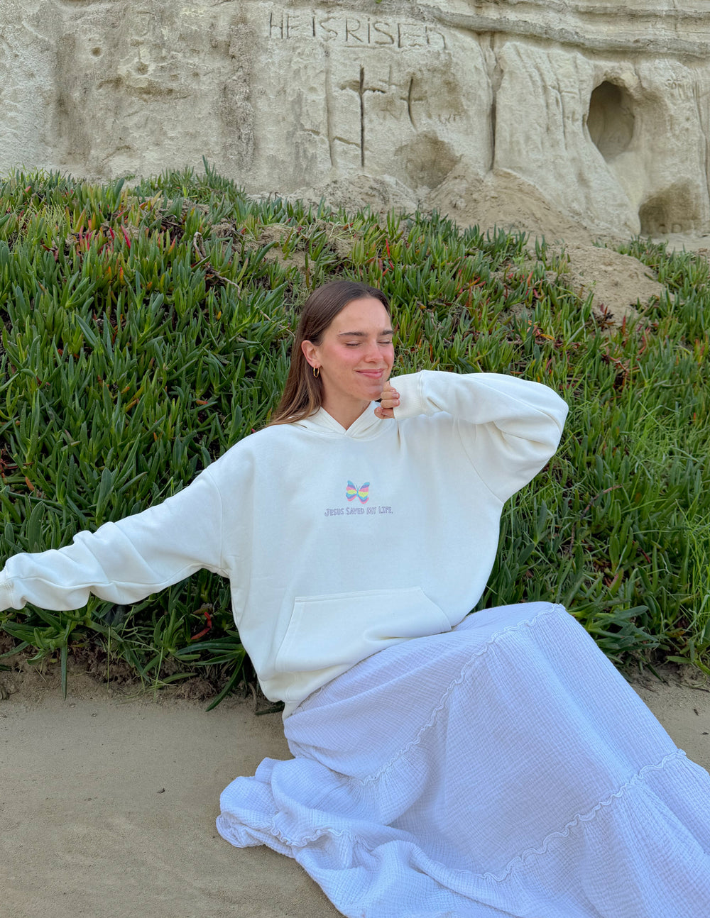 Unisex light-colored hoodie with small chest graphic and front pocket