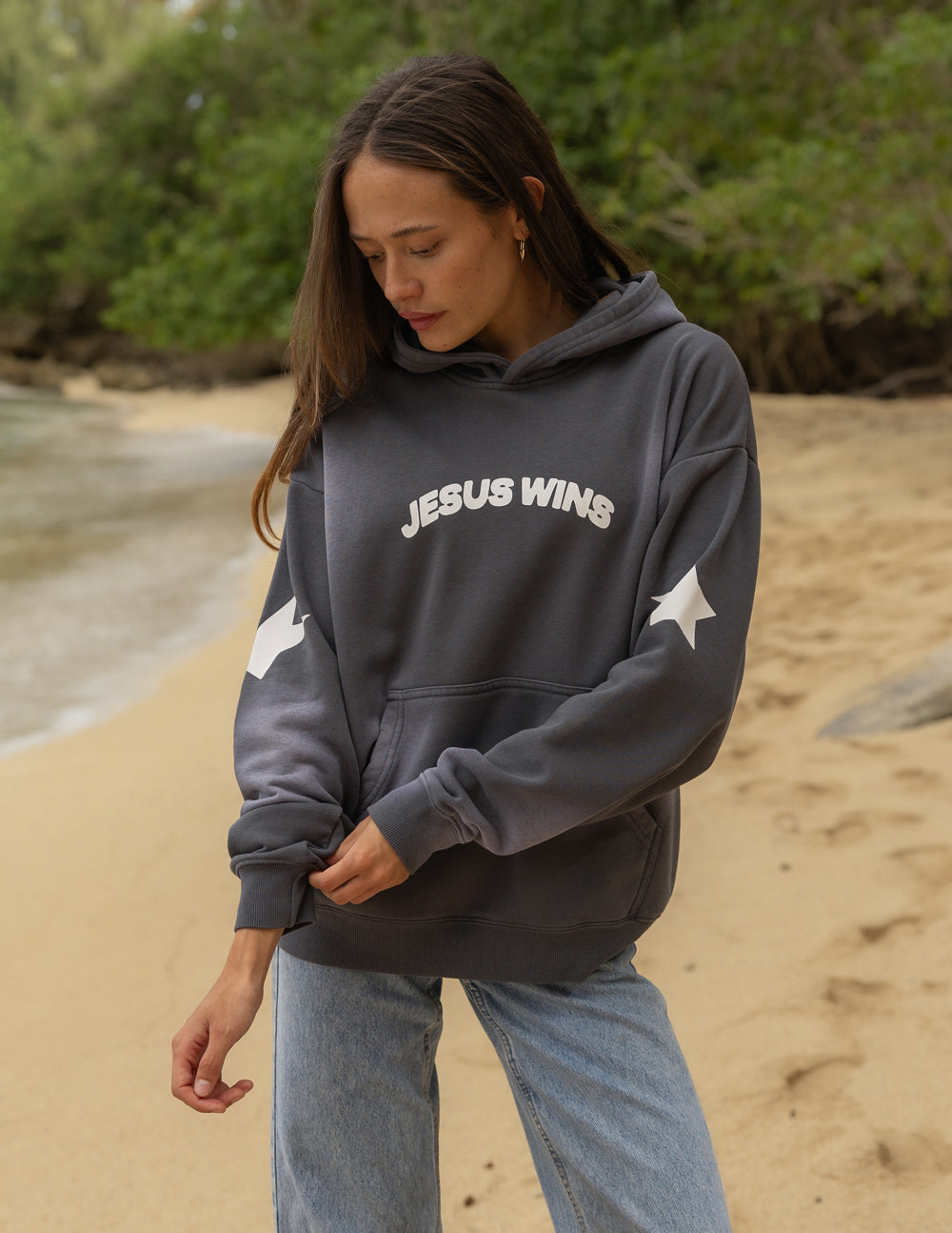 Dark gray unisex hoodie with hood, front pocket, and “JESUS WINS” chest print