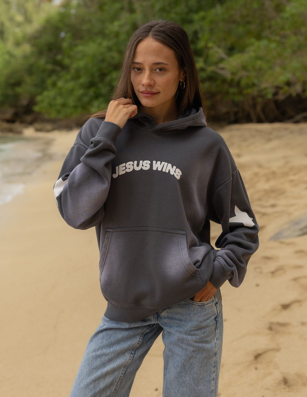 Dark gray unisex hoodie with hood, front pocket, and “JESUS WINS” chest graphic