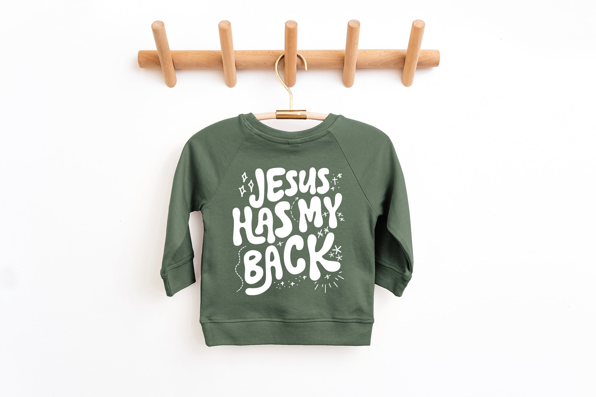 Toddler pullover sweatshirt in dark green with "Jesus has my back" graphic front