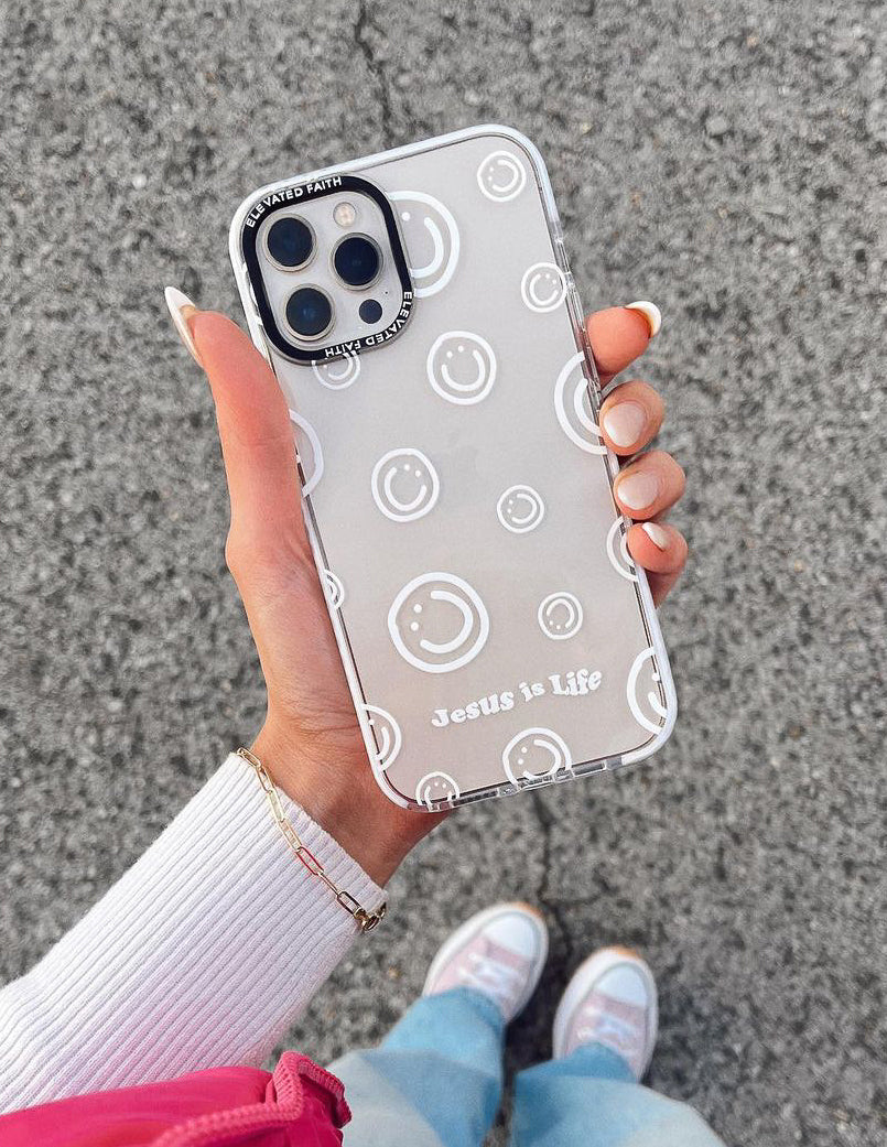 Clear white phone case with circular smiley icons and Jesus is Life text
