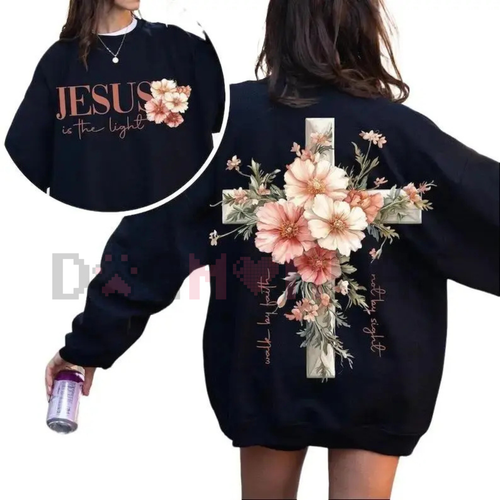 Dark crewneck sweatshirt with floral cross graphic and “Jesus is the light” lettering