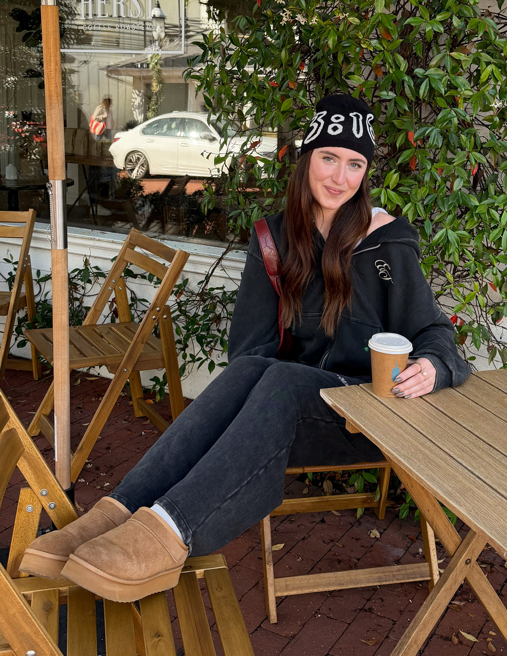 Black knit beanie with white 3:16 lettering graphic, worn outdoors