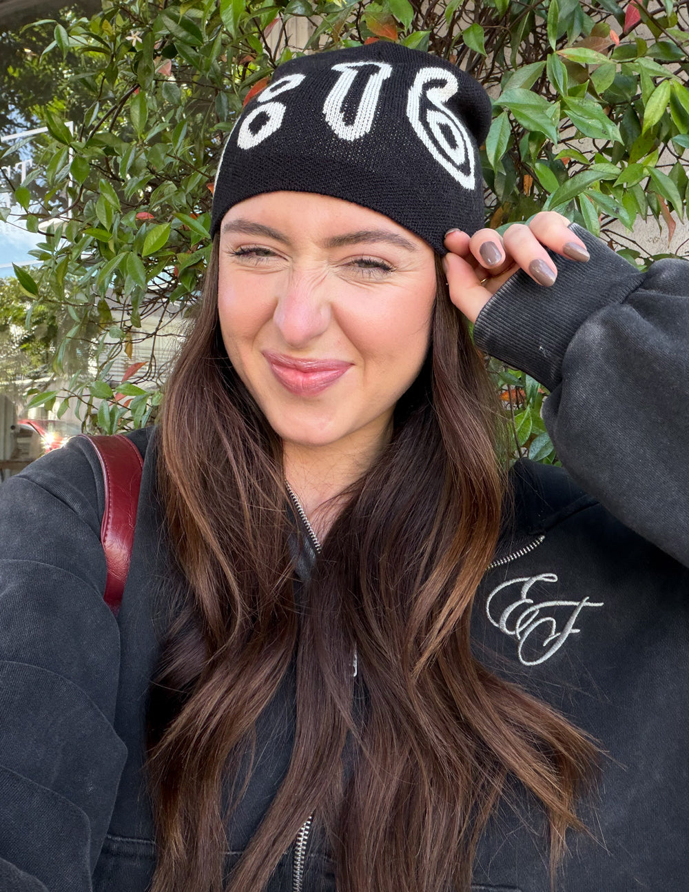 Black beanie with white 3:16 graphic and ribbed knit cuff