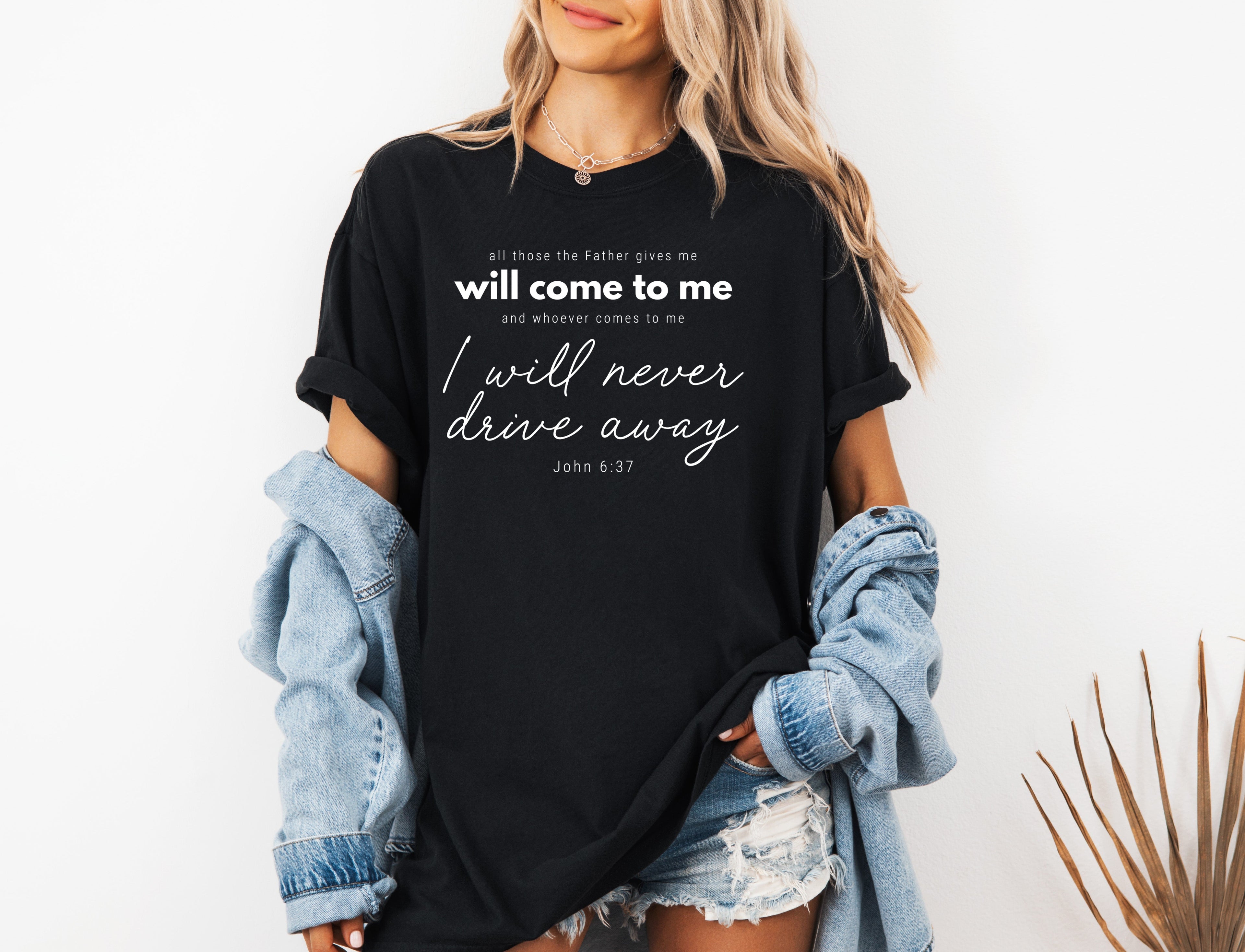 Black crew-neck T-shirt with white quote text and script graphic