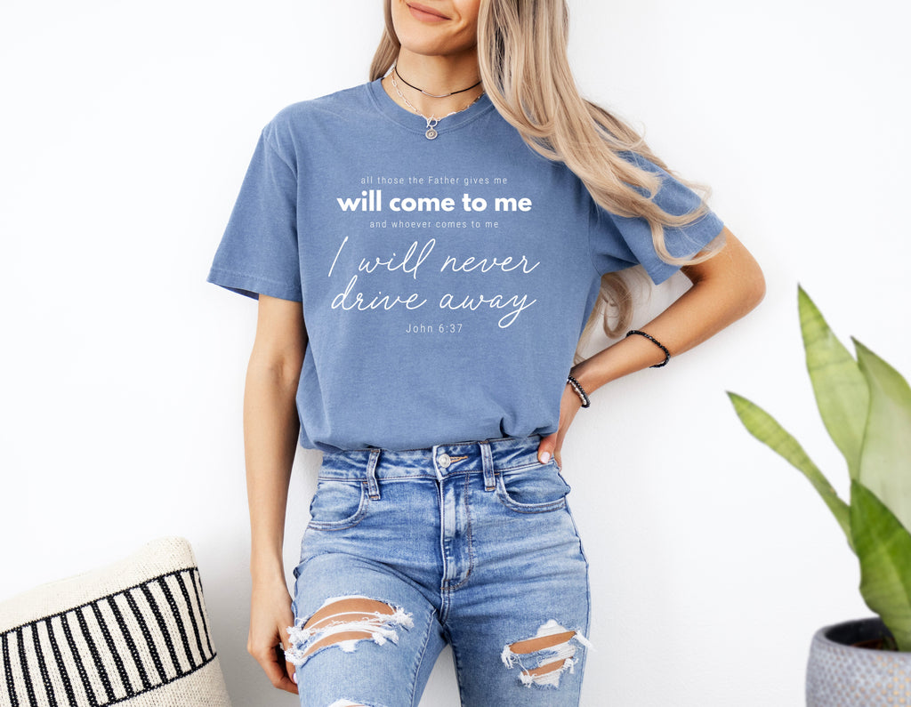 Blue crew-neck T-shirt with white quote text and script graphic