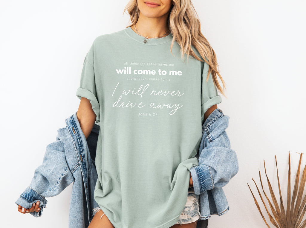 Light green crew-neck T-shirt with white quote text and script graphic