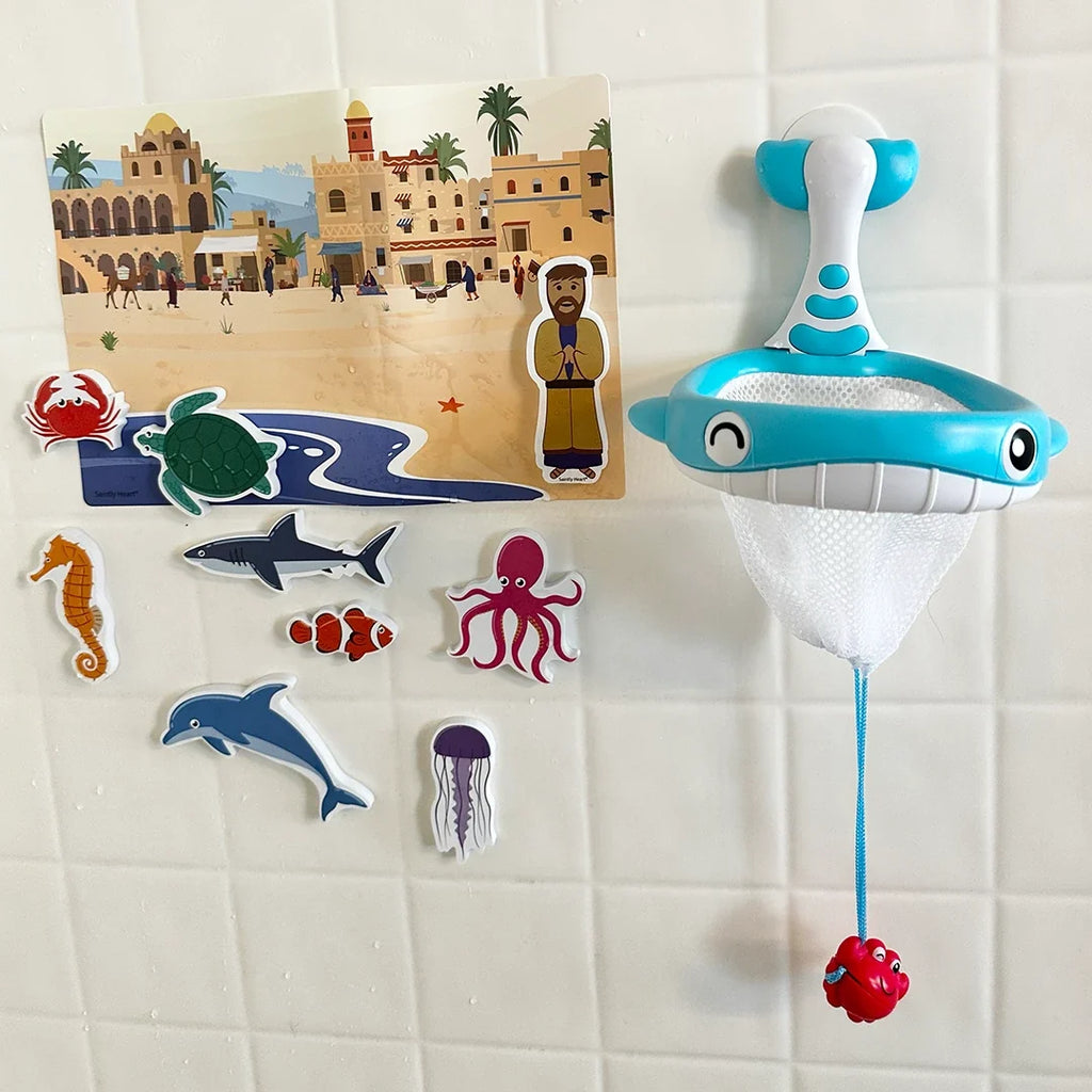 Blue dolphin bath net with mesh pouch and dangling red crab, with ocean animal stickers