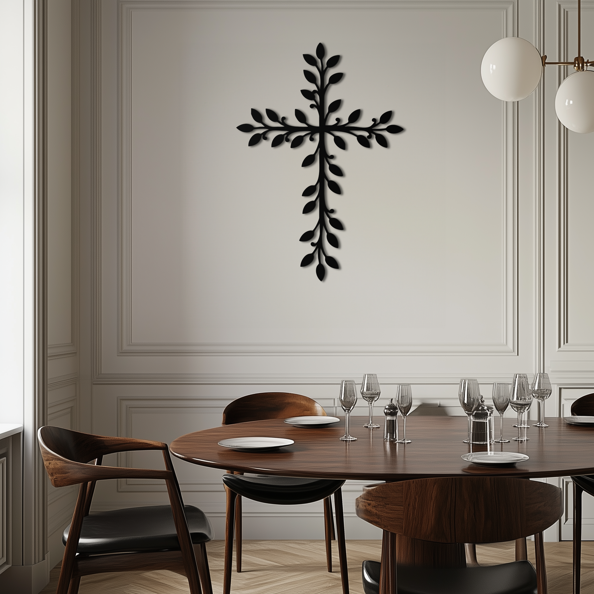 Leaf cross metal wall art with black leaf detailing on light wall