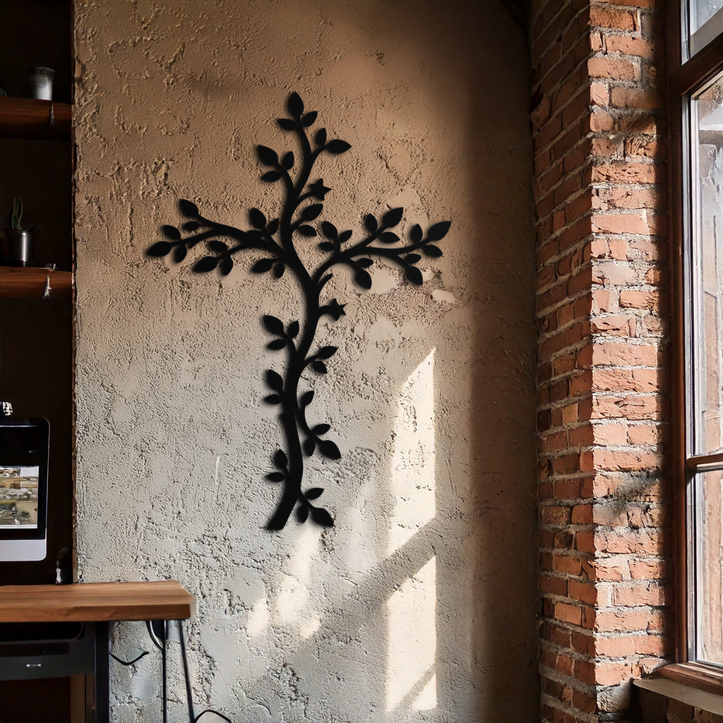 Metal cross wall art with vine and leaf design, black finish