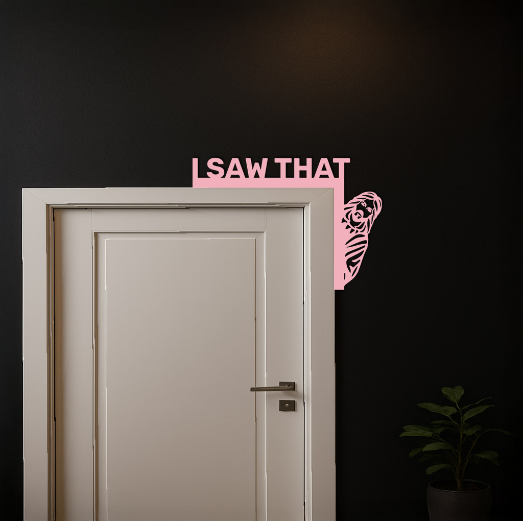 Pink corner metal wall art with 'I SAW THAT' text and rose swirl by door corner