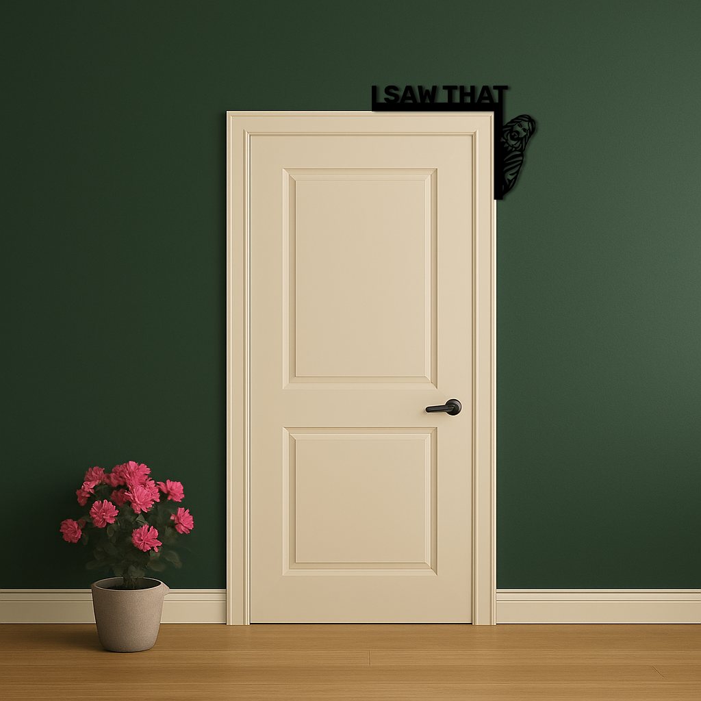Black corner metal wall art with 'I SAW THAT' text and rose swirl beside door