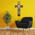 Gold-edged metal Christian wall cross with crucifixion scene and blue sky backdrop
