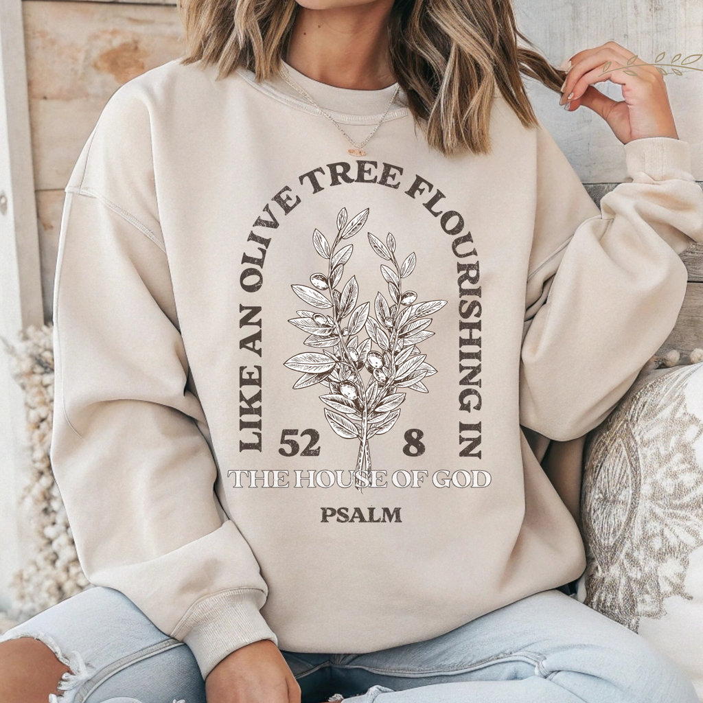Cream crewneck sweatshirt with olive tree emblem and “The House of God” Psalm text