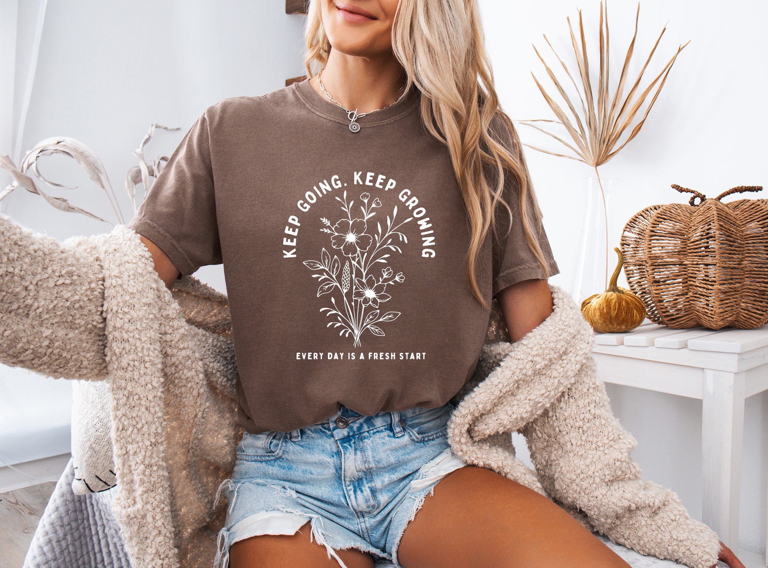 Espresso brown unisex T-shirt with white botanical quote graphic on front.