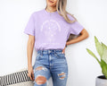 Orchid lavender unisex T-shirt with white botanical quote graphic on front.