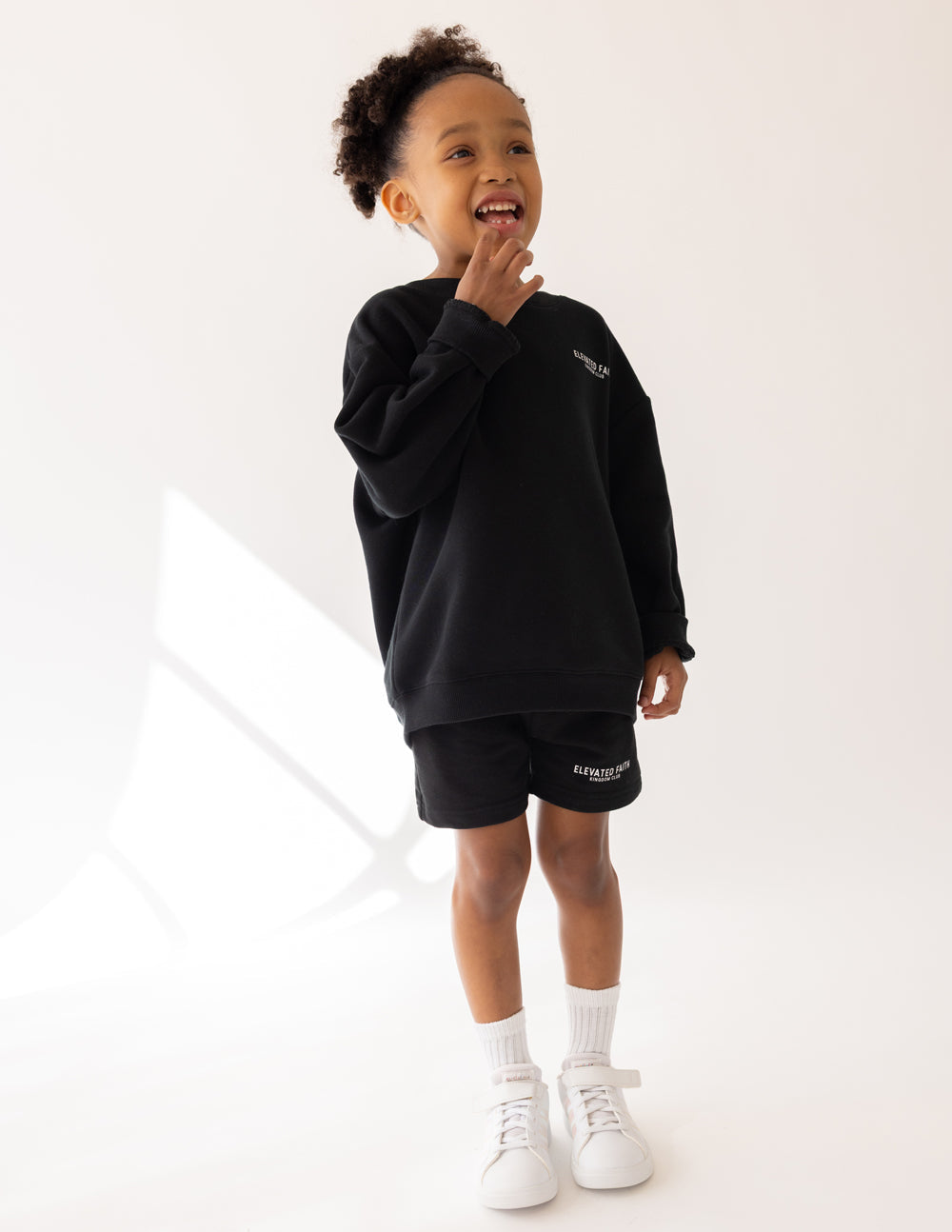 Kids black crewneck sweatshirt with front chest logo, long sleeves