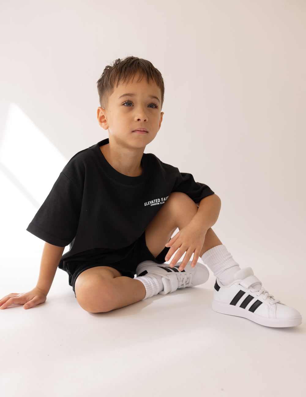 Kids black crew-neck t-shirt with small chest logo print