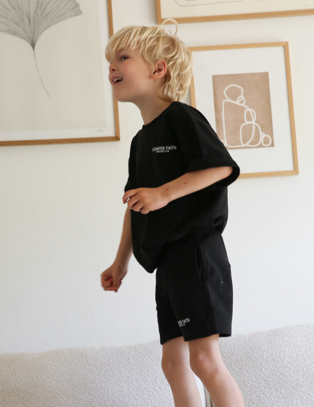 Kids black crew-neck t-shirt with small chest logo print