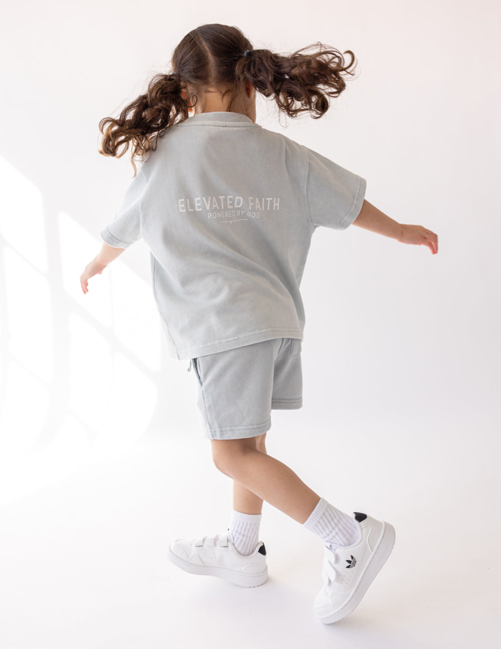 Kids light gray crewneck graphic tee, back print "ELEVATED FAITH"
