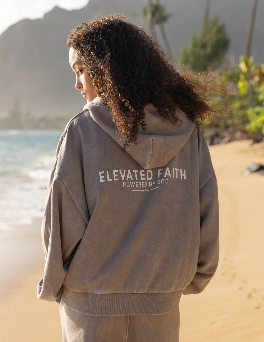 Brown full-zip hoodie with hood and chest logo print