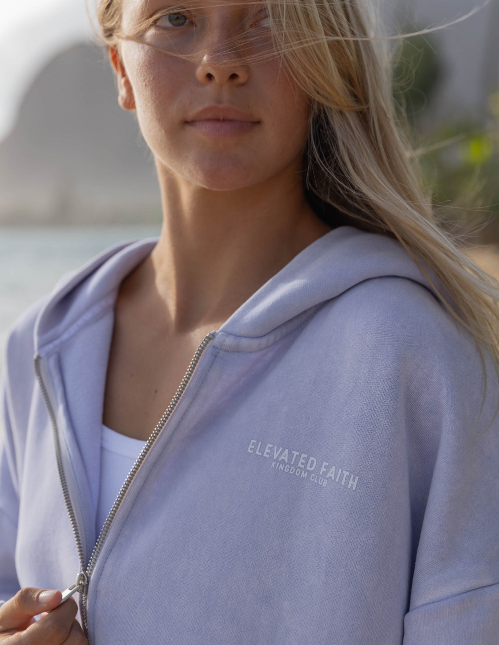 Lavender full-zip hoodie with ELEVATED FAITH chest text and hood