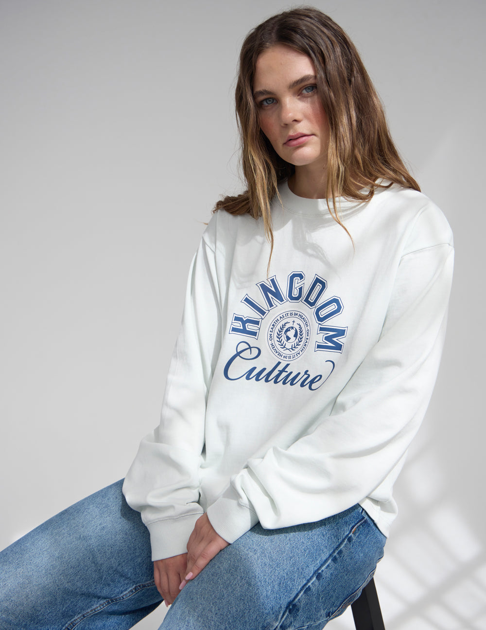 White heavyweight long-sleeve tee with Kingdom Culture graphic on chest