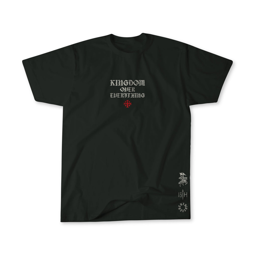 Black premium graphic tee flat lay, small chest logo and sleeve graphic detail.