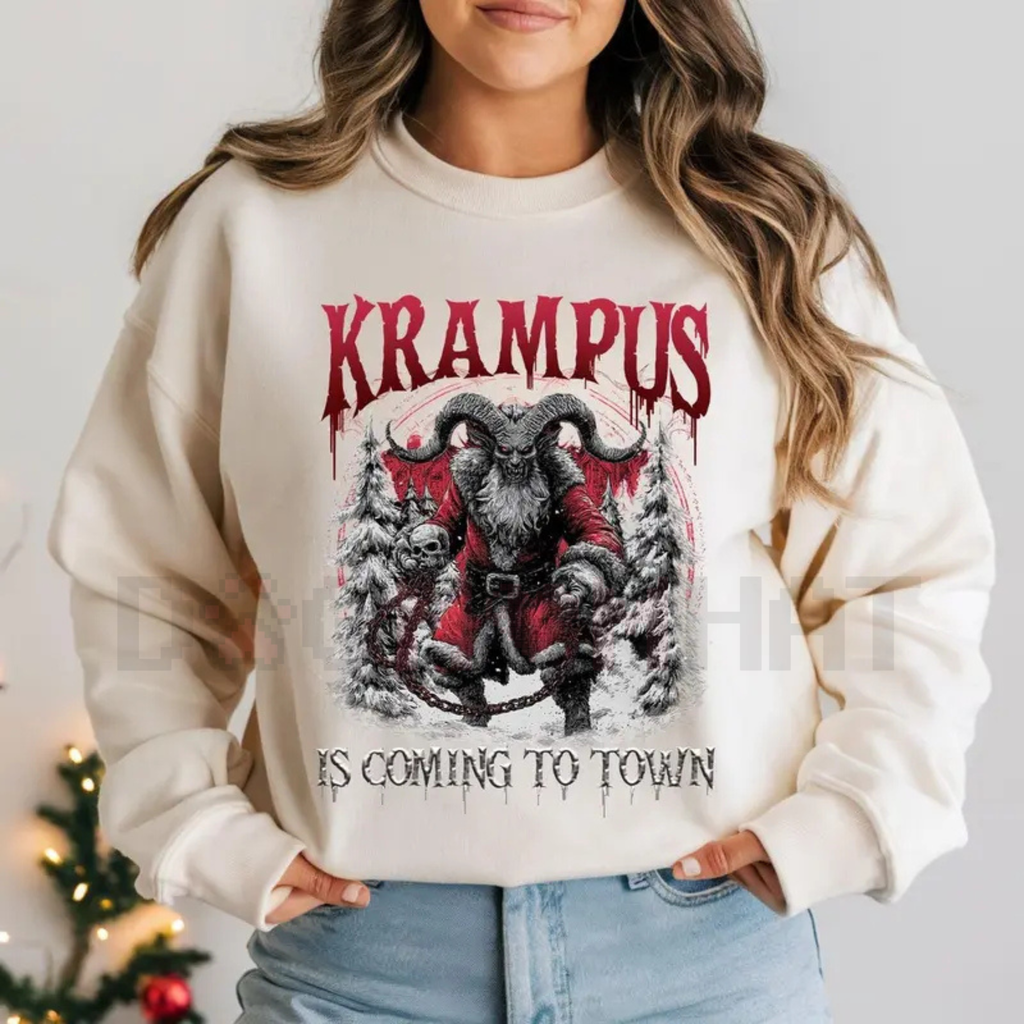 White crewneck sweatshirt with Krampus graphic and 'Is coming to town' text