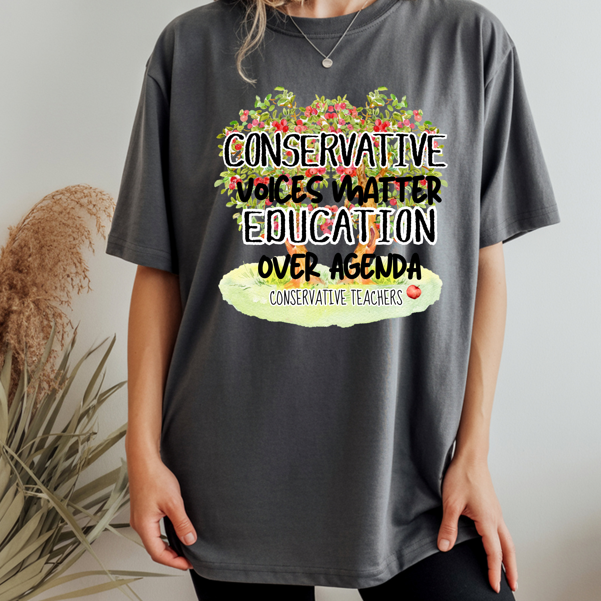 Dark gray Comfort Colors T-shirt with colorful education slogan and teachers text