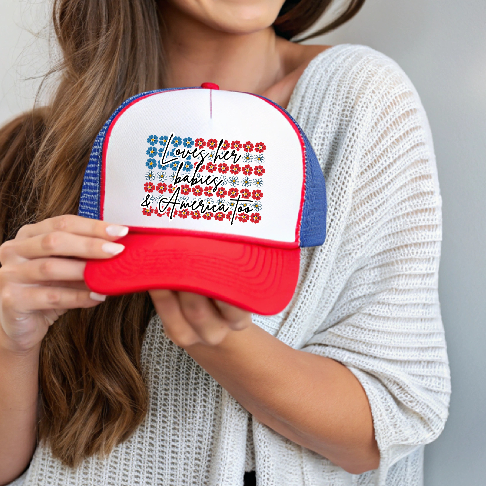 Teacher cap with white front panel, red brim, and blue side panels; colorful text logo
