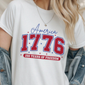 White crewneck T-shirt with '1776' America graphic and '250 Years of Freedom'