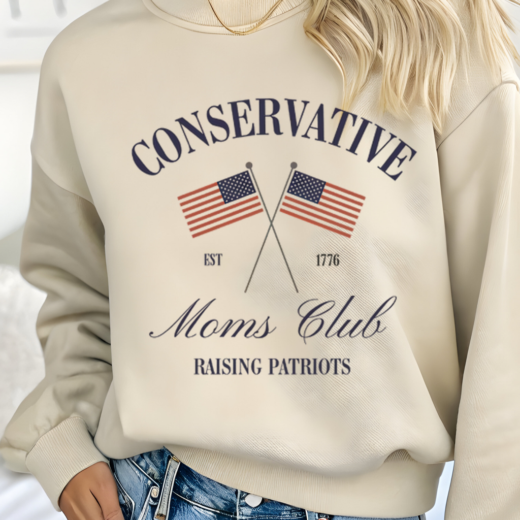 Cream graphic hoodie with 'Conservative Moms Club' patriotic flag cross design